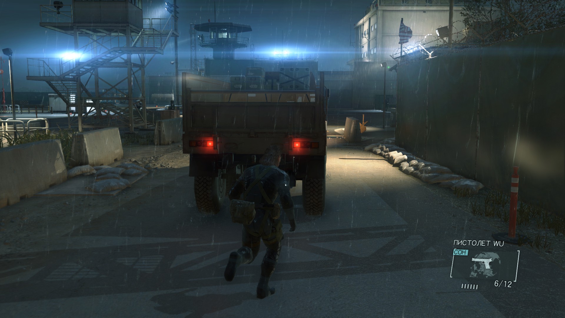 Through the guarded gate you can penetrate at least in three ways. One of them is in the back of this truck.